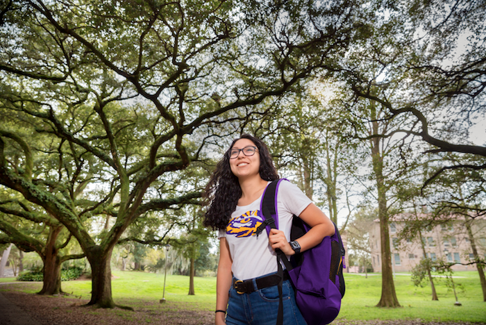 LSU Admissions - Priscilla in Forest Student walking on campus