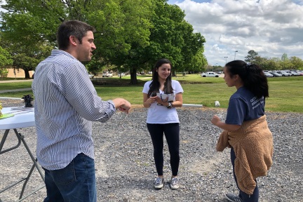 Language lab director visits with students