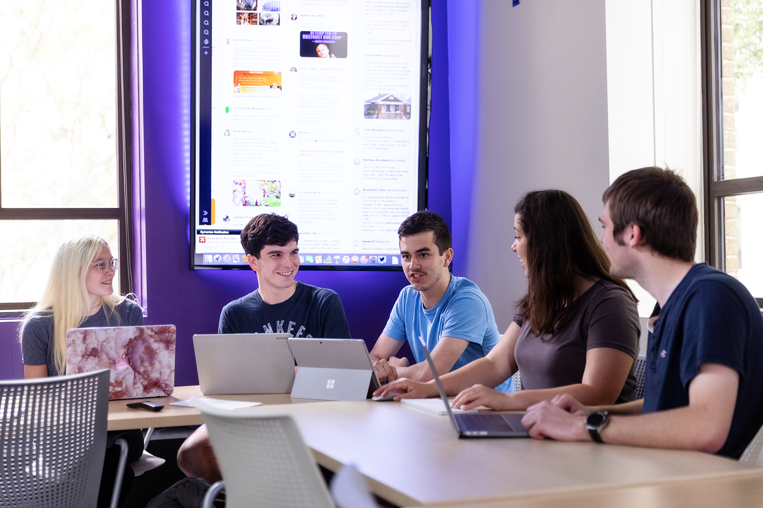 Students in the SMAC Lab Group of students around a table